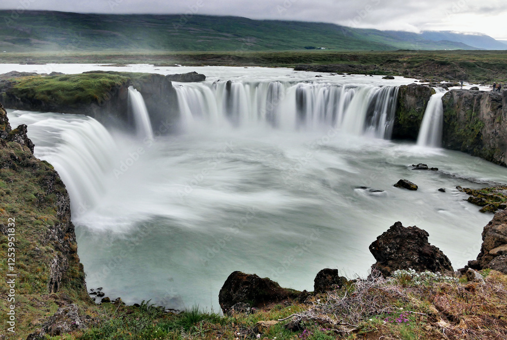 Waterfall in volcanic landscape in Iceland Waterfall in volcanic landscape in Iceland