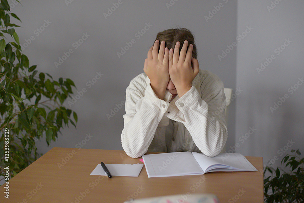 Teenage girl studying at the desk being tired, Teenage girl studying at the desk being tired,