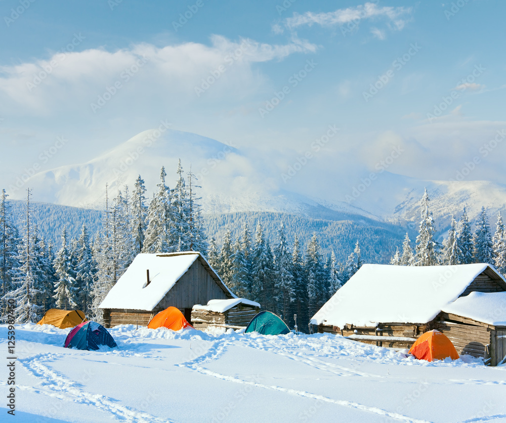Winter calm mountain landscape with shed and mount ridge behind (Carpathian Mountains, Ukraine)