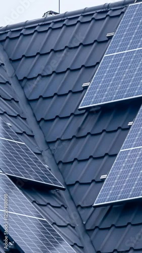 photovoltaic panels on a black metal roof tile