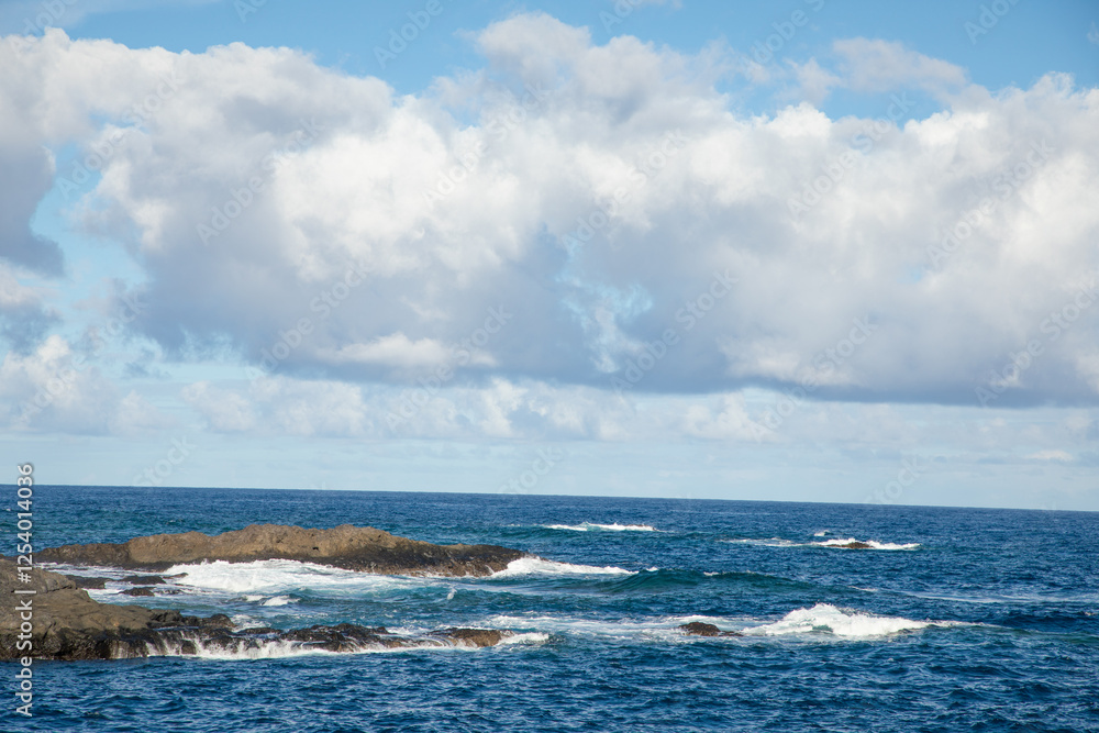 Sea foam and Atlantic Ocean waves crashing against rocks Sea foam and Atlantic Ocean waves crashing against rocks