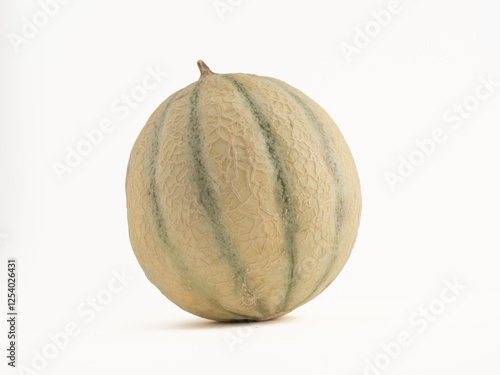 whole fresh green striped cantaloupe melon isolated on a white background photo