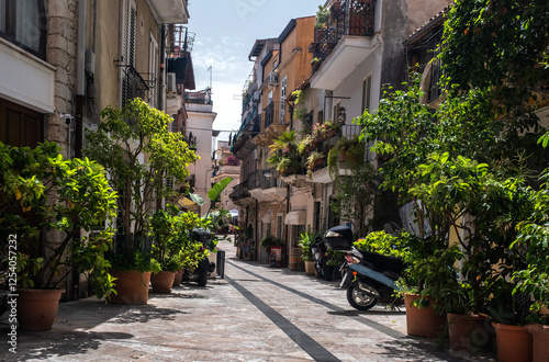 Fototapeta Naklejka Na Ścianę i Meble -  Taormina, Italy. A narrow street in the old town