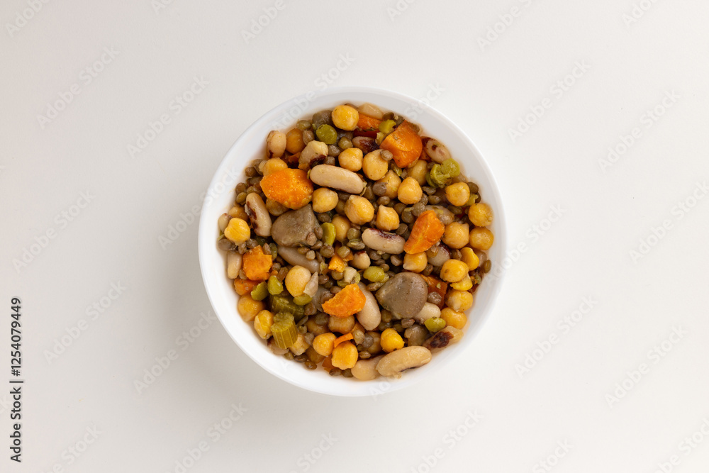A top view of a round white bowl filled with summer vegetable salad, set against a white background. Simple, clean design, perfect for food styling, product mockups, or promotional use. A top view of a round white bowl filled with summer vegetable salad, set against a white background. Simple, clean design, perfect for food styling, product mockups, or promotional use.