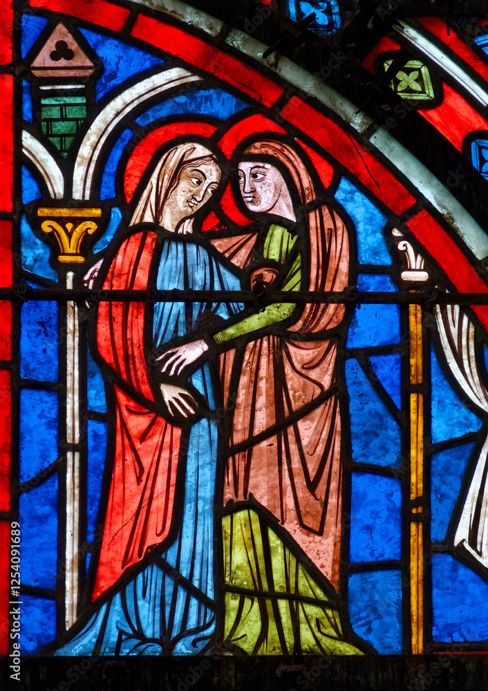 Stained glass (19th century) of Visitation of the Virgin Mary to her pregnant cousin Elizabeth. . Stained glass (19th century) of Visitation of the Virgin Mary to her pregnant cousin Elizabeth. .