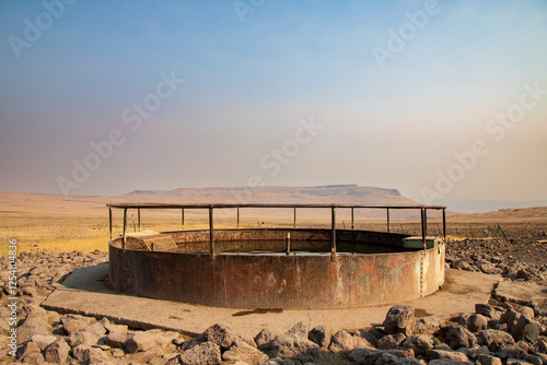 A weathered water trough provides essential hydration for livestock and wildlife in the arid Smoke Creek Desert near Antelope Springs, Lassen County, California.