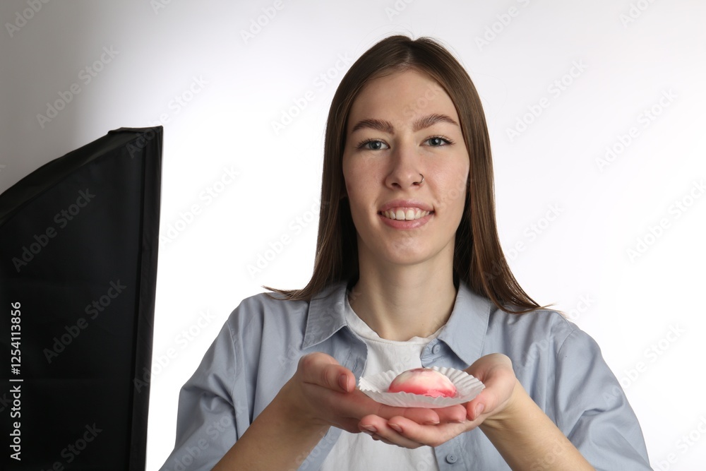Smiling woman with tasty mochi on white background Smiling woman with tasty mochi on white background