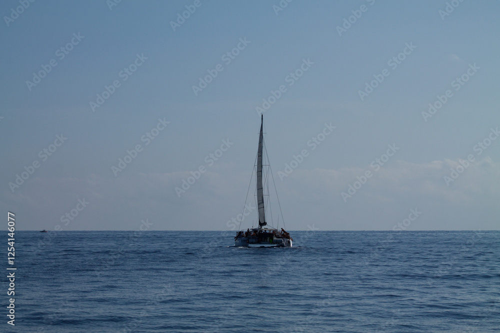 Obraz premium Sailboat on a Calm Ocean