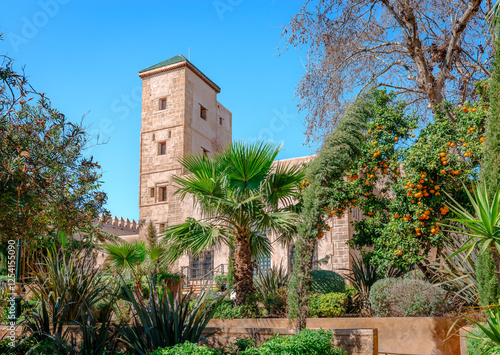 The Andalusian Gardens of the Kasbah of the Udayas in Rabat, Morocco with the National Museum of Jewelry and Adornment in the background.