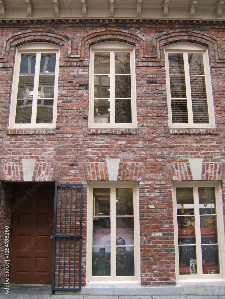 Fototapeta premium old brick building with wood windows
