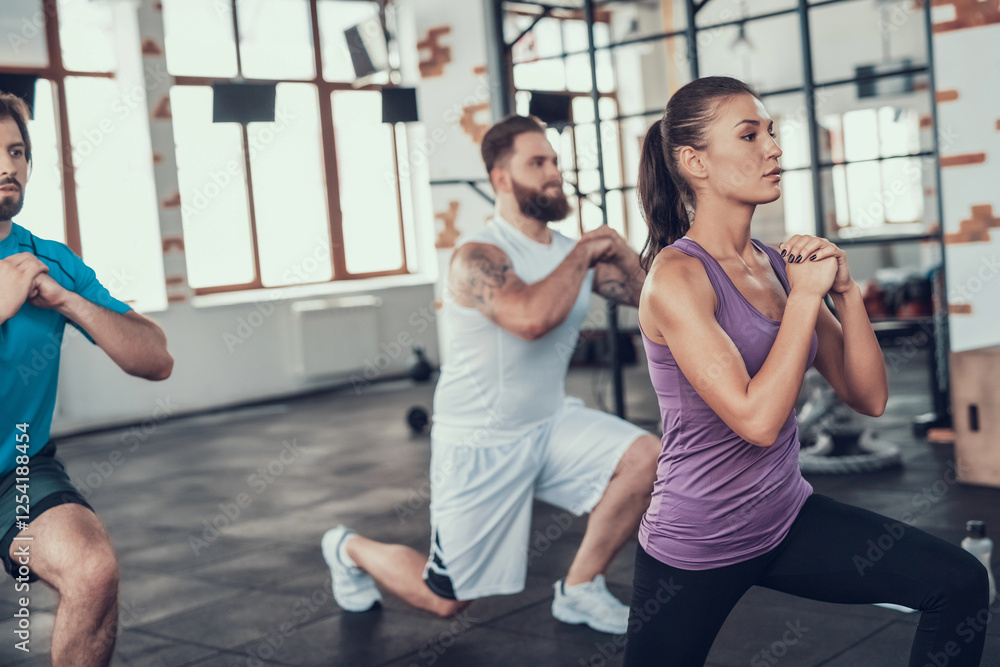 Girl And Two Guys Doing Lunge Exercises In Gym. Girl And Two Guys Doing Lunge Exercises In Gym.