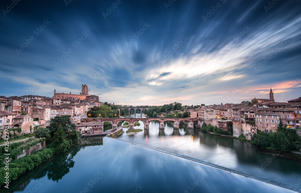 Fototapeta premium Beautiful evening view of Albi with its historic buildings and river under a dynamic sky