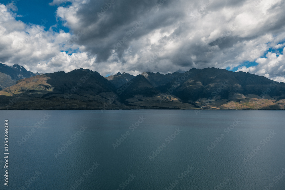 Mountains on the side of a lake in new Zealand.