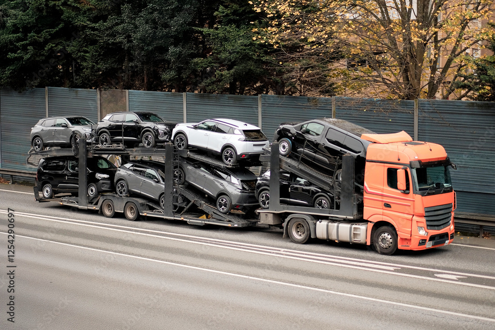 Obraz premium Dealership Car Carrier Truck Transporting Brand-New vehicles for Logistics Distribution
