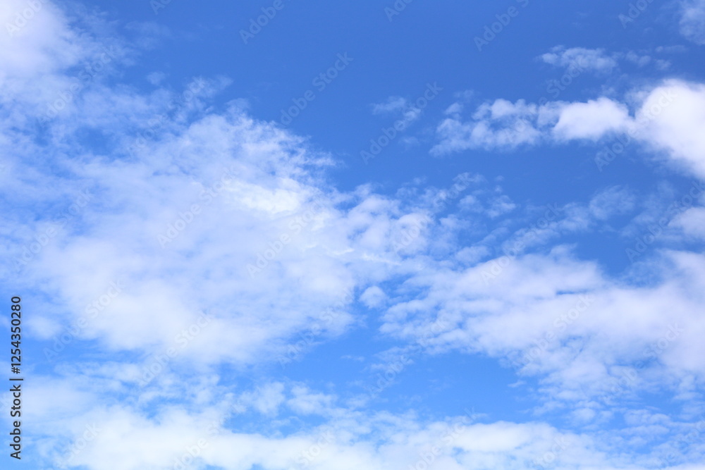 Blue sky with white clouds in the daytime background. Blue sky with white clouds in the daytime background.