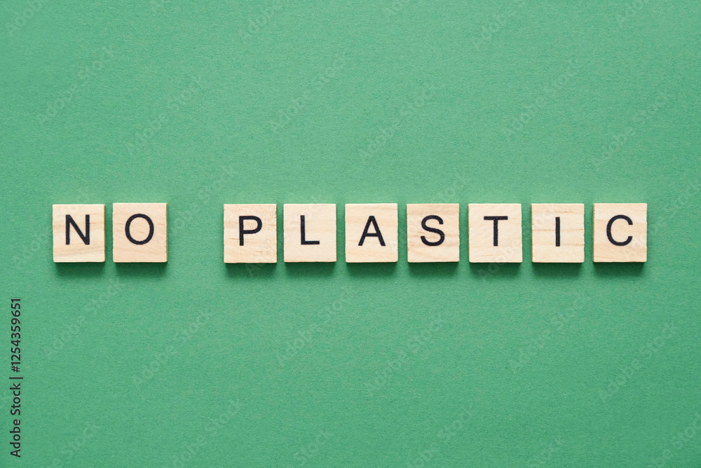 Wood pieces with letters form a message of sustainability: no plastic Wood pieces with letters form a message of sustainability: no plastic
