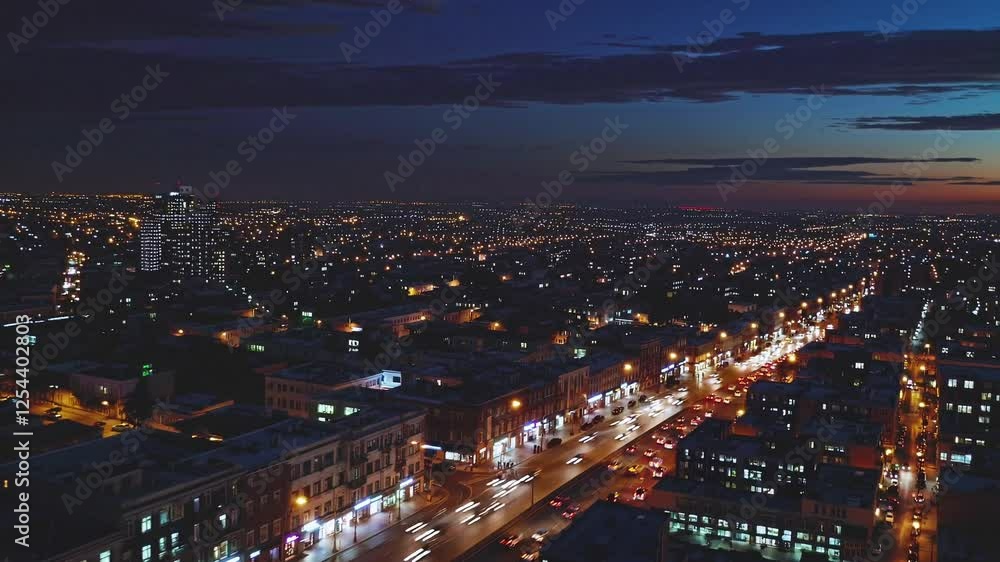 Nighttime Aerial View of a City Street and Skyline with Traffic Nighttime Aerial View of a City Street and Skyline with Traffic