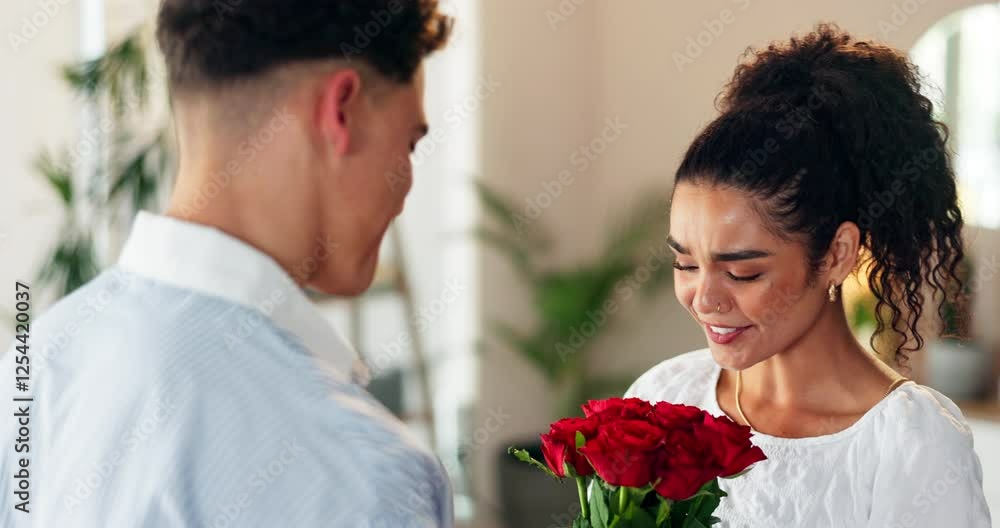 Flowers, romance or surprise with couple in home together for anniversary or valentines day. Hug, smile and thank you with man giving bouquet to woman in apartment for celebration, gift or love Flowers, romance or surprise with couple in home together for anniversary or valentines day. Hug, smile and thank you with man giving bouquet to woman in apartment for celebration, gift or love