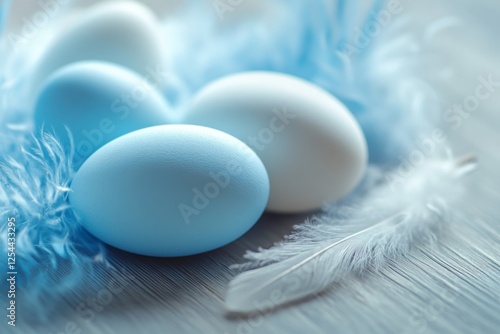 close-up of Easter blue and white eggs with feathers on light wooden table 