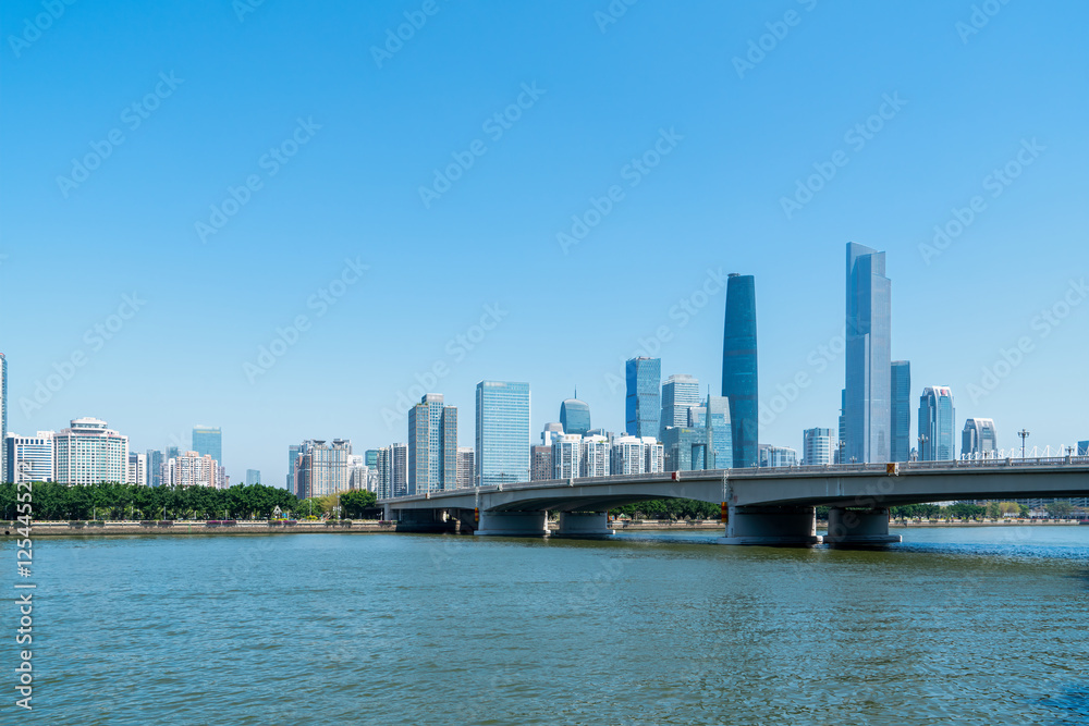 Modern Urban Skyline with River View and Bridge Modern Urban Skyline with River View and Bridge
