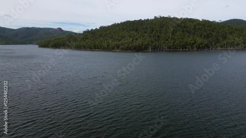 Right to left aerial views of Advancetown Lake near the Western Boat Ramp on the Gold Coast Hinterland. photo