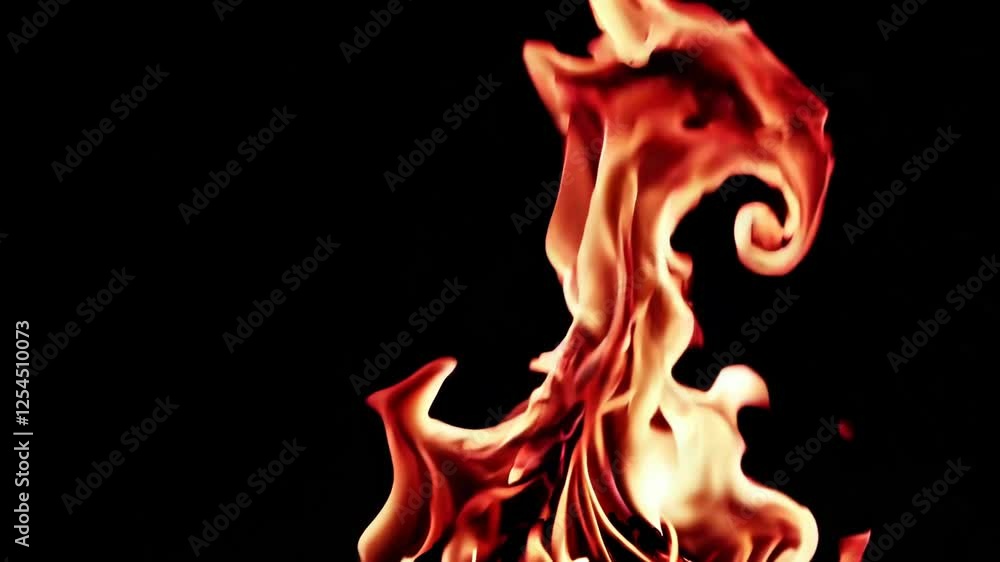 Flames against dark background, dynamic energy concept Flames against dark background, dynamic energy concept