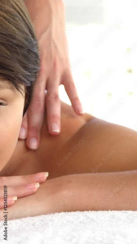 Front view of woman therapist massaging the shoulders of her patient Front view of woman therapist massaging the shoulders of her patient