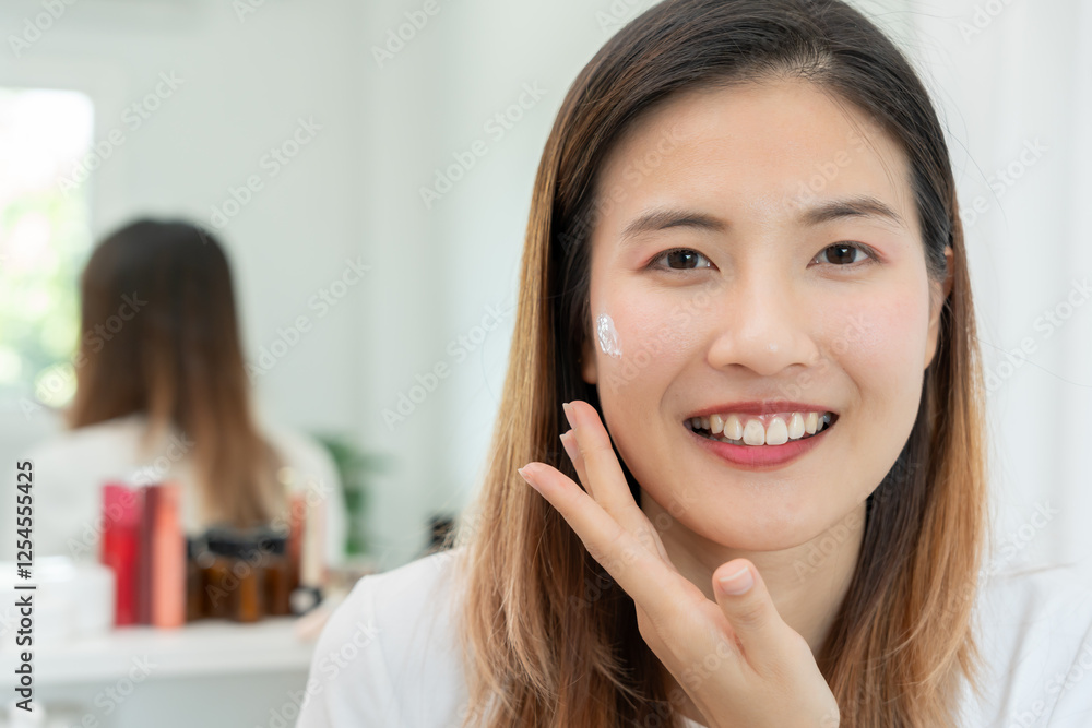 Beautiful Asian woman smile use cream for good skin. face of a healthy woman apply cream and makeup. Advertisement for skin cream, anti-wrinkle, baby face, whitening, moisturizer, tighten pores serum Beautiful Asian woman smile use cream for good skin. face of a healthy woman apply cream and makeup. Advertisement for skin cream, anti-wrinkle, baby face, whitening, moisturizer, tighten pores serum