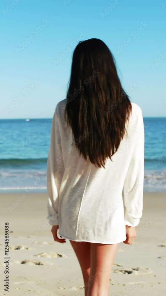 Woman walking on beach