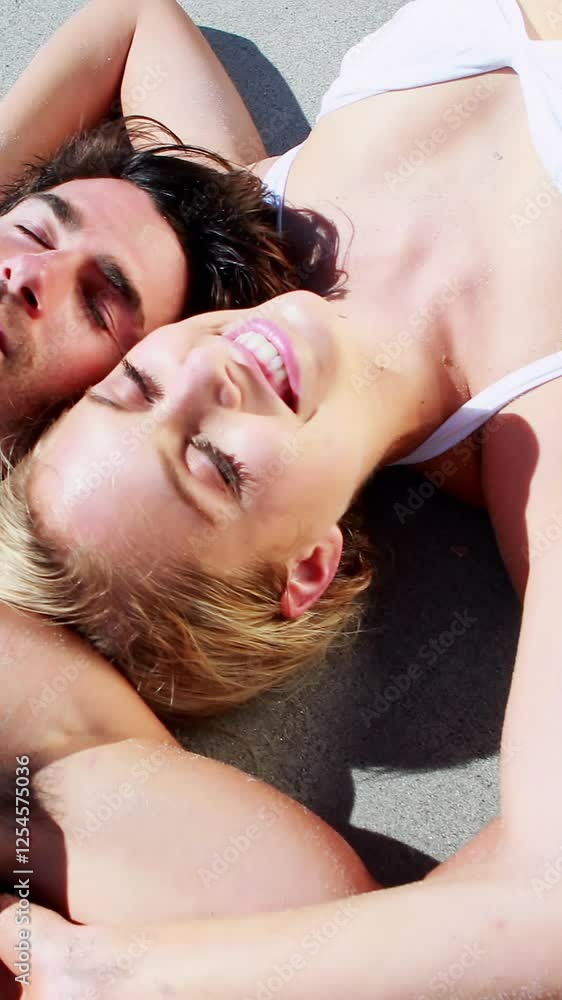 Couple relaxing together on beach Couple relaxing together on beach