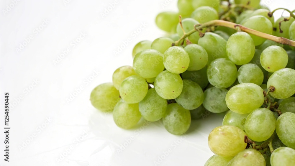 A Bunch of Fresh Green Grapes on a White Background A Bunch of Fresh Green Grapes on a White Background
