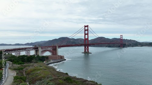 Aerial view toward Golden Gate Bridge across San Francisco Bay on overcast day photo