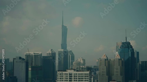 Static shot of skyline of Kuala Lumpur city featuring Warisan Merdeka tower in Malaysia. photo