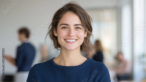Australian businesswoman wearing blue smart-casual smiling at office activity