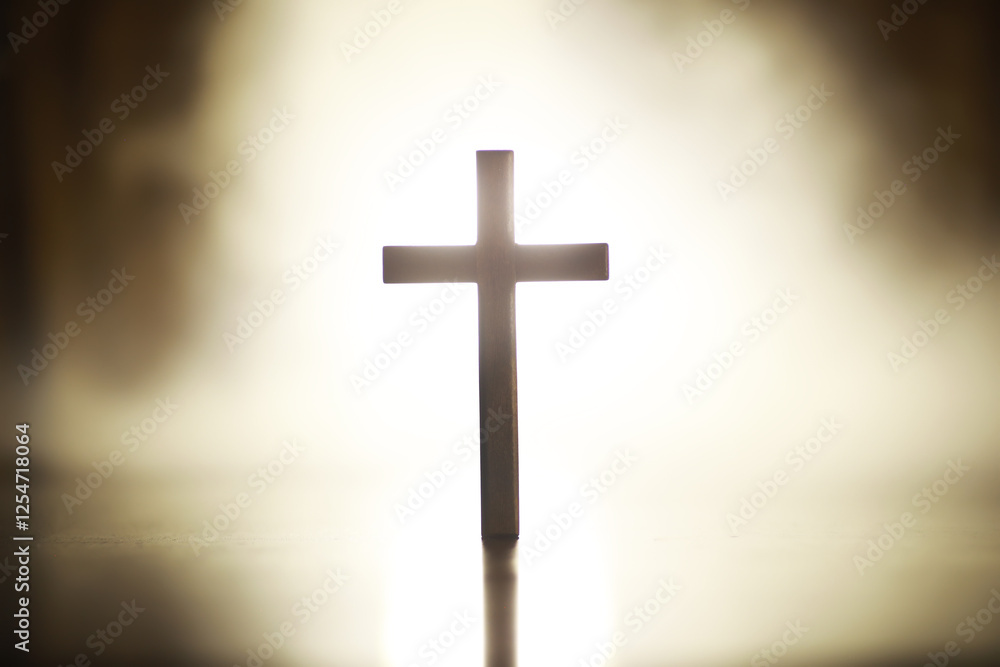 Naklejka premium Silhouetted Cross with Radiant Light Background - Spiritual Symbolism and Hope