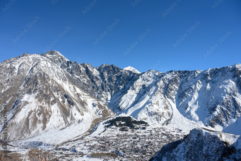 Fototapeta premium Nature of snow-capped mountains in the Caucasus Mountains in winter