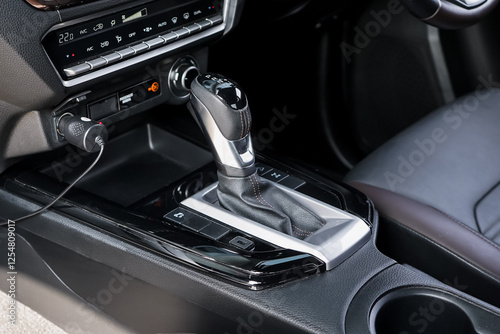 automatic transmission shift selector in the car interior. Closeup a manual shift of modern car gear shifter. 4x4 gear shift	