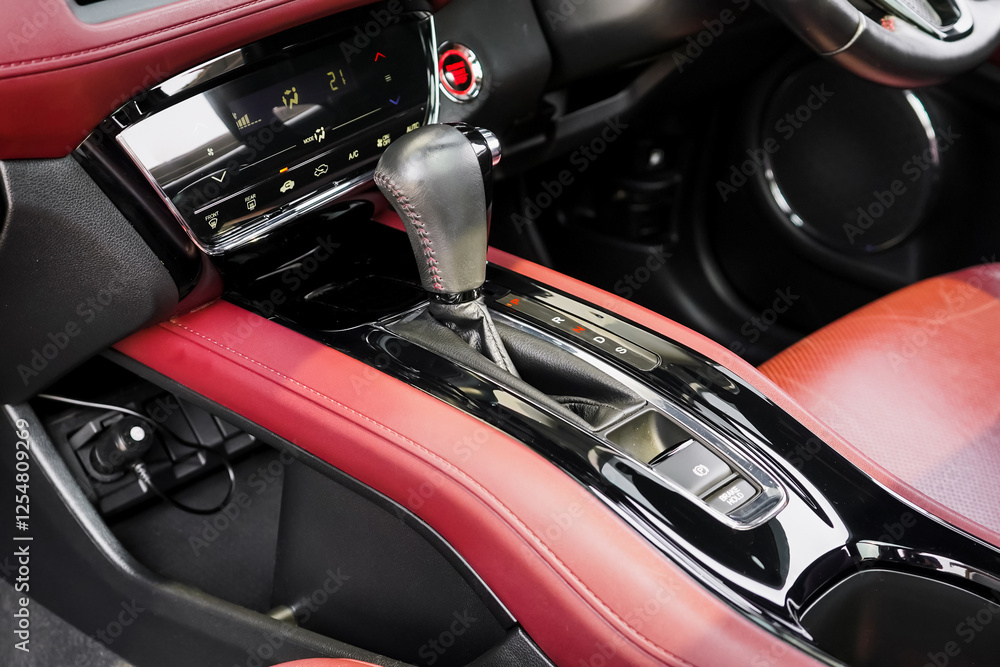 automatic transmission shift selector in the car interior. Closeup a manual shift of modern car gear shifter. 4x4 gear shift. automatic transmission shift selector in the car interior. Closeup a manual shift of modern car gear shifter. 4x4 gear shift.