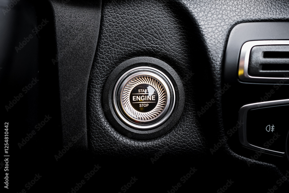 Close up engine car start button. Start stop engine modern new car button,Makes it easy to turn your auto mobile on and off. a key fob unique ,selective focus Close up engine car start button. Start stop engine modern new car button,Makes it easy to turn your auto mobile on and off. a key fob unique ,selective focus