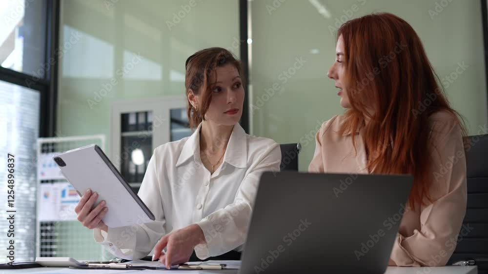 Diverse Business Team Discusses Financial Project Analysis in Meeting. Diverse Business Team Discusses Financial Project Analysis in Meeting.