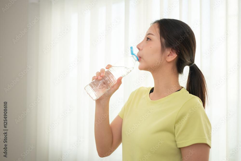 Portrait of young sports women breaks and drinks water after yoga practice Portrait of young sports women breaks and drinks water after yoga practice