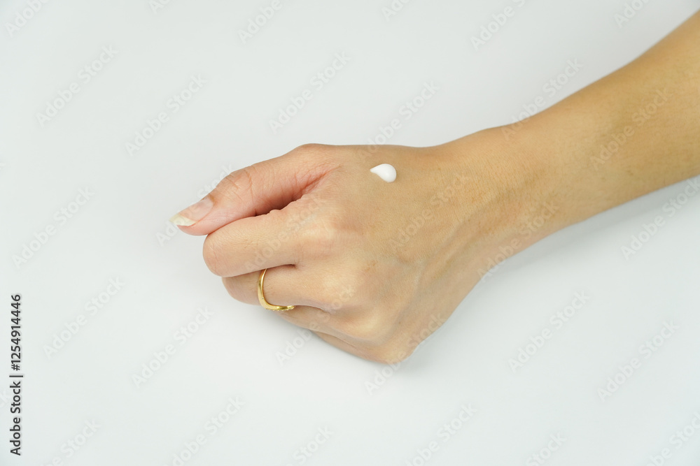 Application of Moisturizing Cream on woman Hand isolated on white background Application of Moisturizing Cream on woman Hand isolated on white background
