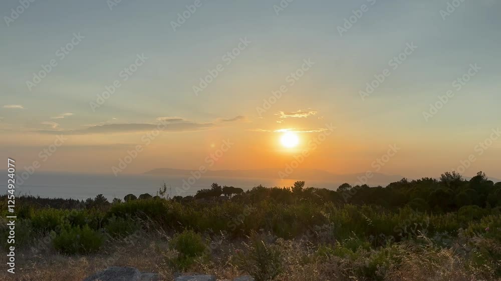 Sunset on the horizon mediterranean sea with rocks, pine trees waves hitting the shore, rocking seabed, great holiday, tourism, tranquil, luxury view. Sunset on the horizon mediterranean sea with rocks, pine trees waves hitting the shore, rocking seabed, great holiday, tourism, tranquil, luxury view.