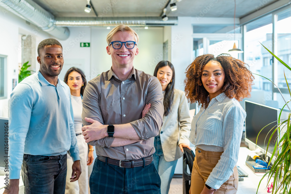 Startup team smiling in coworking office, multi ethnic professionals collaborating Startup team smiling in coworking office, multi ethnic professionals collaborating