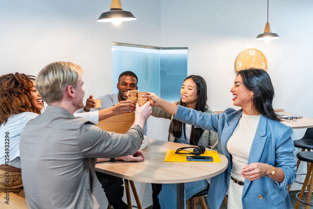 Happy multiethnic business team toasting with coffee in coworking office Happy multiethnic business team toasting with coffee in coworking office