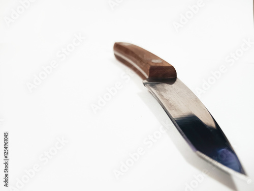 Knife is placed on a white background.