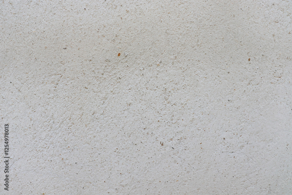 An old, uneven white cement surface.