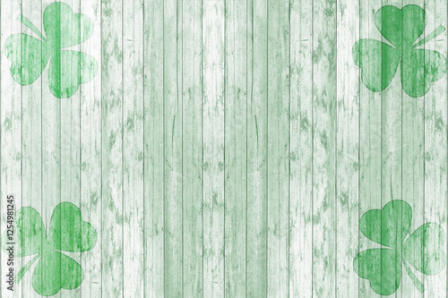 St Patricks day background. Shamrocks over a light green wood background. photo