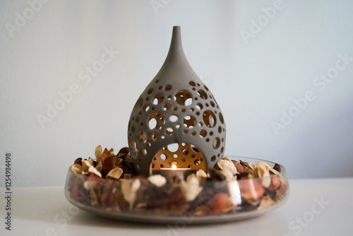 Canvastavla candle burning in a bowl of potpourri for relaxation