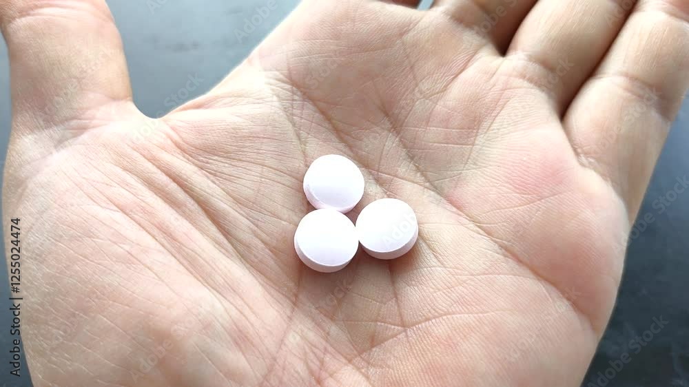 Close up pills in hand, indoor Chiangmai Thailand. Close up pills in hand, indoor Chiangmai Thailand.